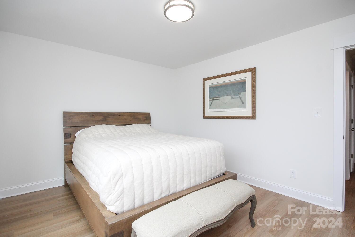 1088 Startown Road Lincolnton, NC 28092 - Photo 41 of 48 a bedroom with a bed and painting on the wall