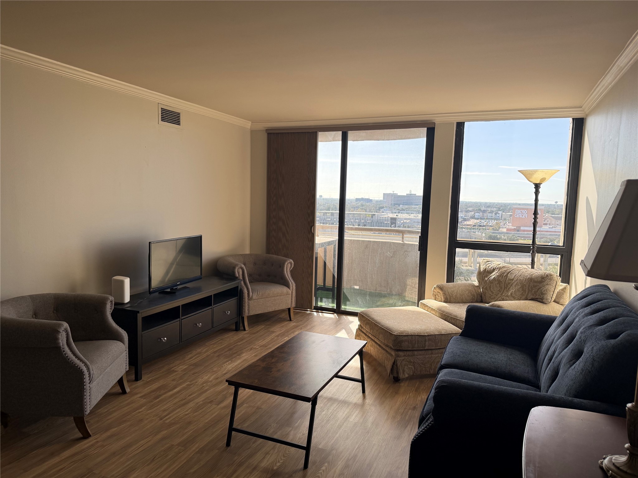 3525 Sage Road, Unit 1217 Houston, TX 77056 - Photo 1 of 27 a living room with furniture and a large window