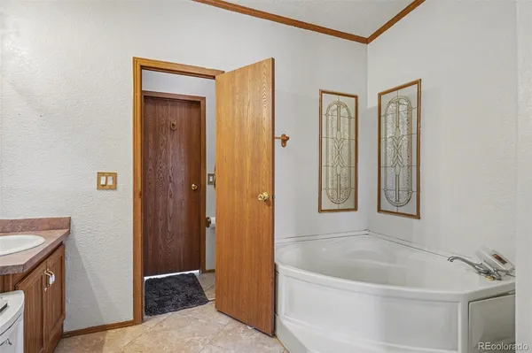 a bath room with a bath tub and a shower