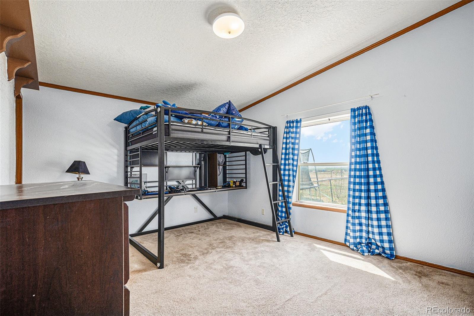 8260 County Road 39 Fort Lupton, CO 80621 - Photo 17 of 32 a view of a livingroom with furniture and floor to ceiling window