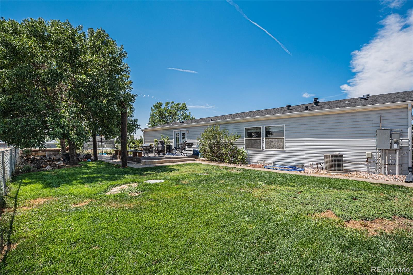 8260 County Road 39 Fort Lupton, CO 80621 - Photo 24 of 32 a house view with a sitting space and garden