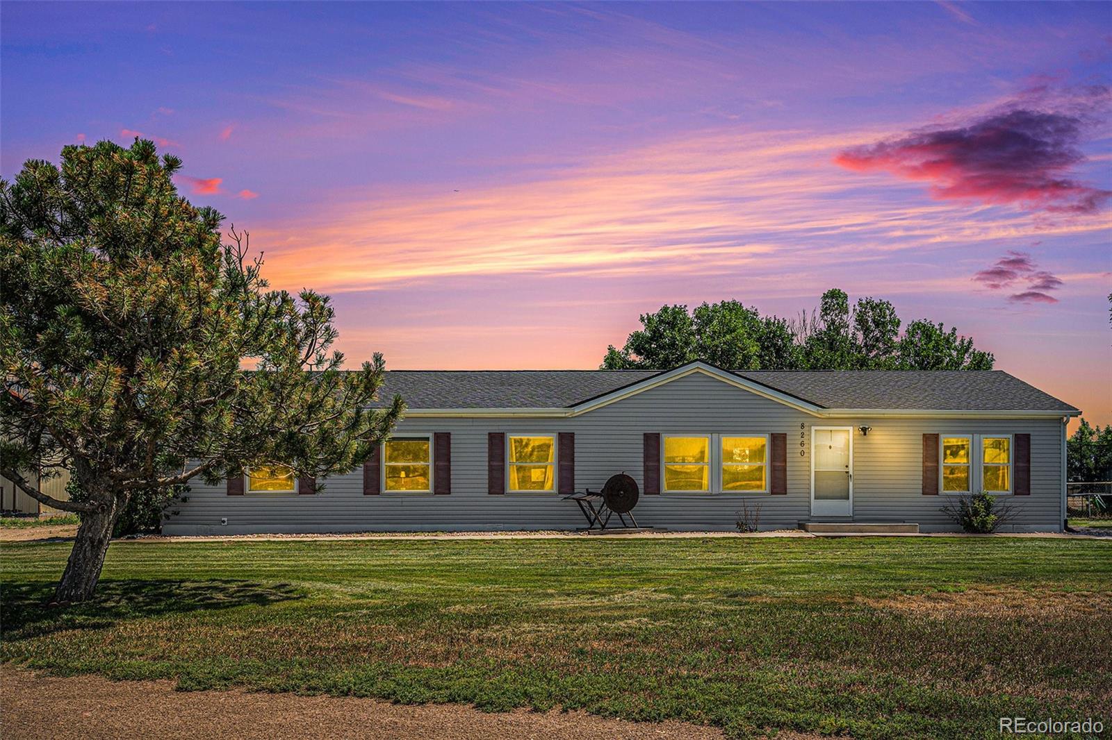 8260 County Road 39 Fort Lupton, CO 80621 - Photo 3 of 32 a front view of a house with a yard