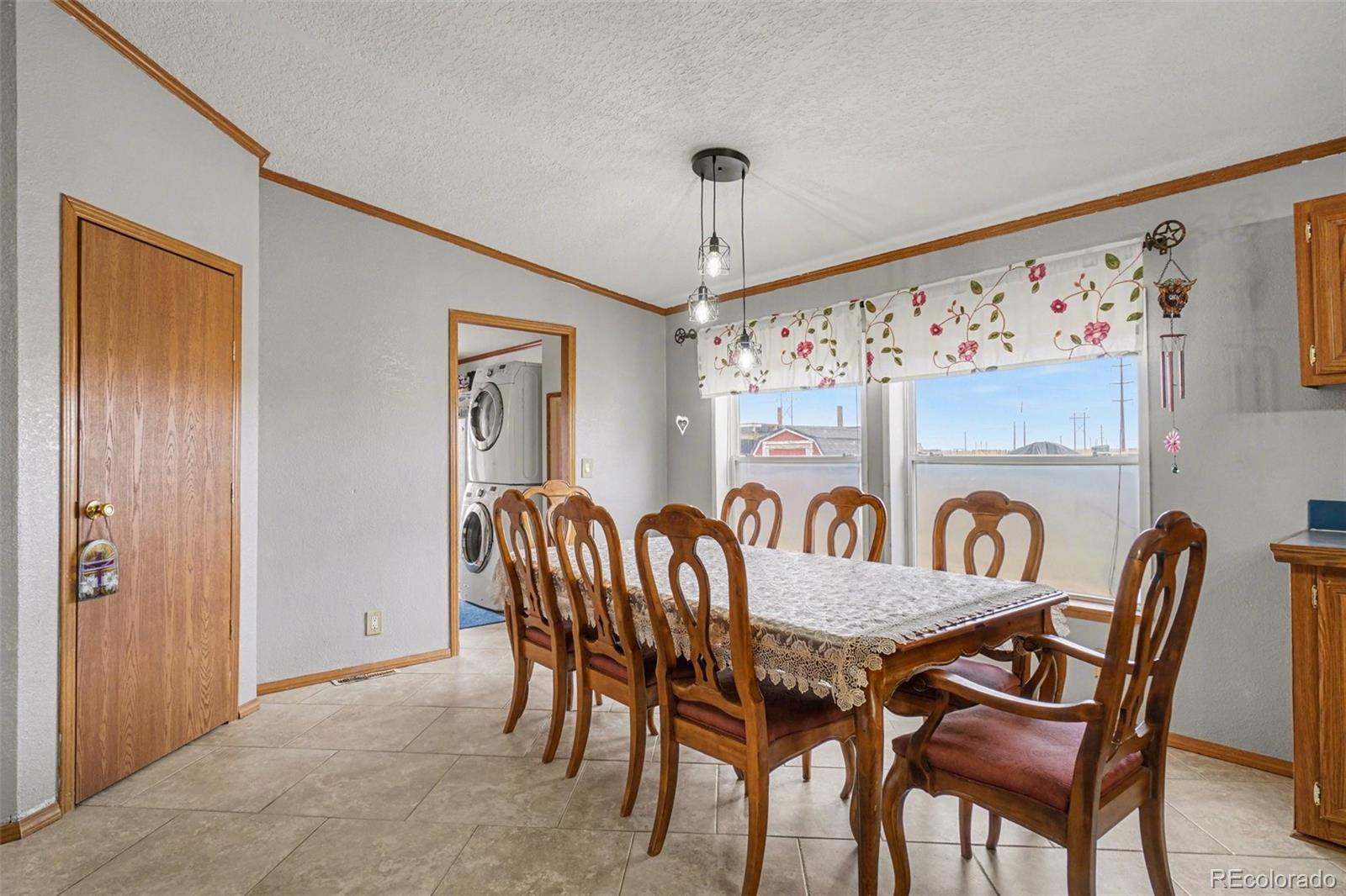 8260 County Road 39 Fort Lupton, CO 80621 - Photo 8 of 32 a view of a dining room with furniture