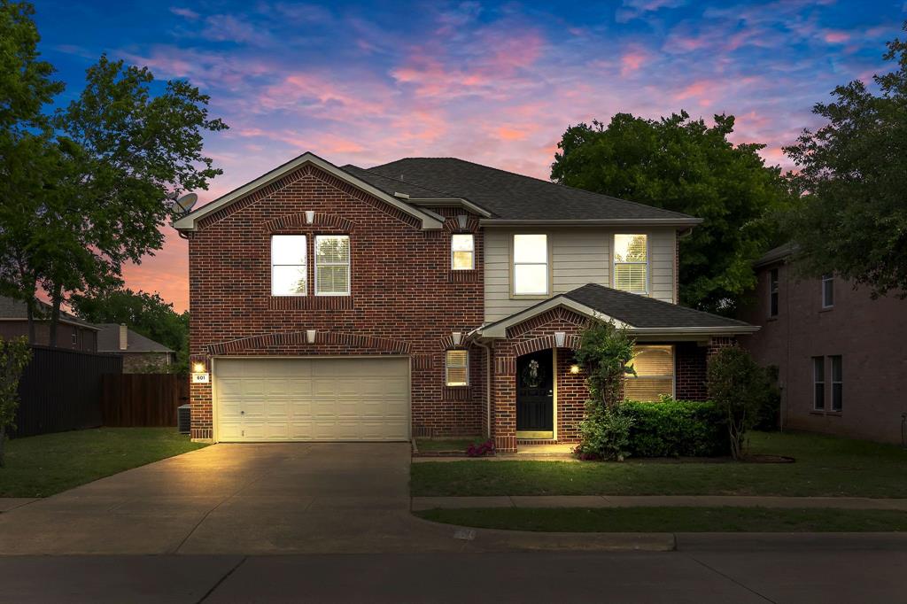 601 Amy Way Euless, TX 76039 - Photo 39 of 40 a front view of a house with a yard and garage