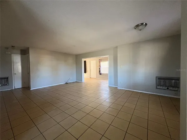 a view of an empty room and window