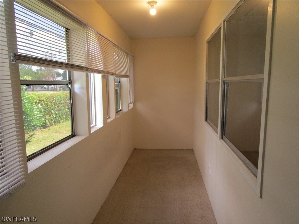 15790 Pine Ridge Road Fort Myers, FL 33908 - Photo 12 of 17 a view of a hallway with windows