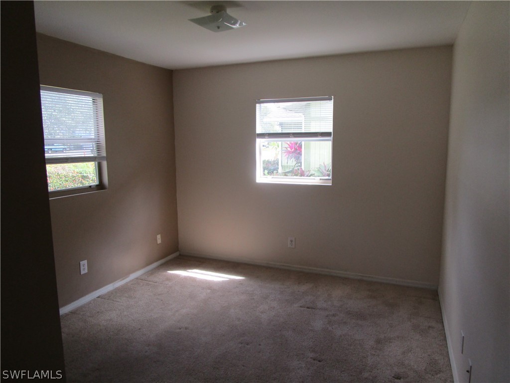15790 Pine Ridge Road Fort Myers, FL 33908 - Photo 13 of 17 an empty room with windows