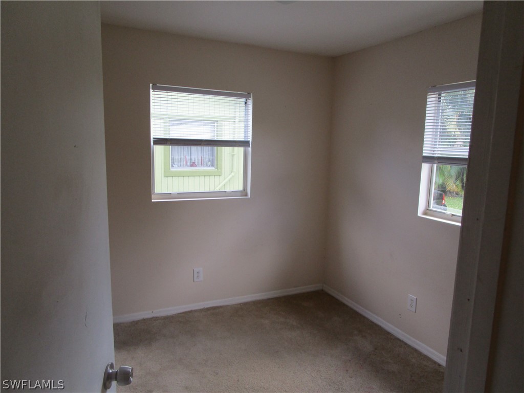 15790 Pine Ridge Road Fort Myers, FL 33908 - Photo 15 of 17 an empty room with a window