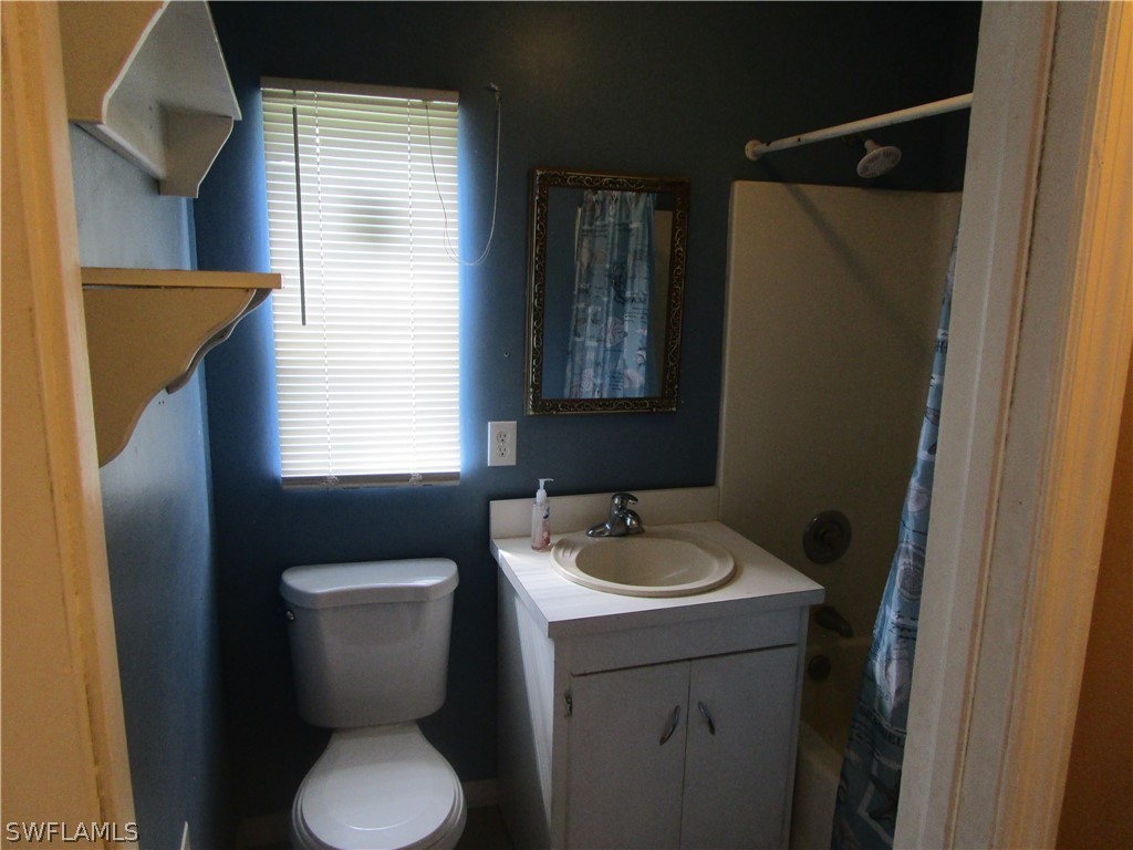 15790 Pine Ridge Road Fort Myers, FL 33908 - Photo 16 of 17 a bathroom with a sink and a toilet