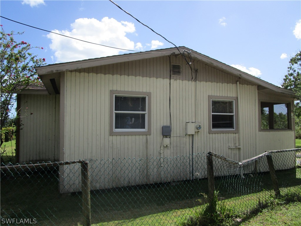 15790 Pine Ridge Road Fort Myers, FL 33908 - Photo 4 of 17 a front view of a house with sitting space
