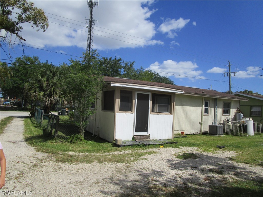 15790 Pine Ridge Road Fort Myers, FL 33908 - Photo 5 of 17 a view of a house with a yard