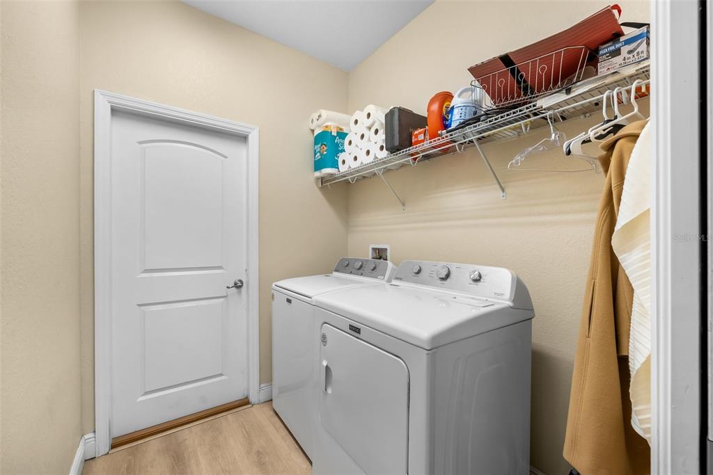 13391 Ruffed Grouse Road Weeki Wachee, FL 34614 - Photo 18 of 25 a utility room with dryer and washer