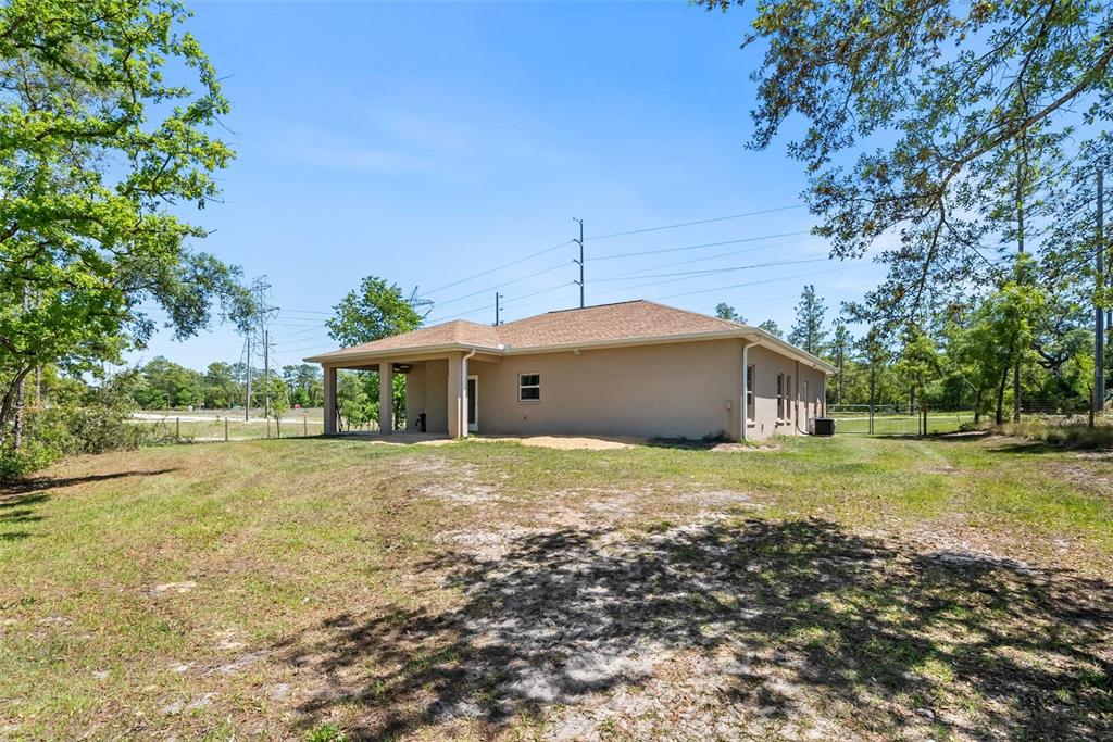 13391 Ruffed Grouse Road Weeki Wachee, FL 34614 - Photo 22 of 25 a house view with a outdoor space