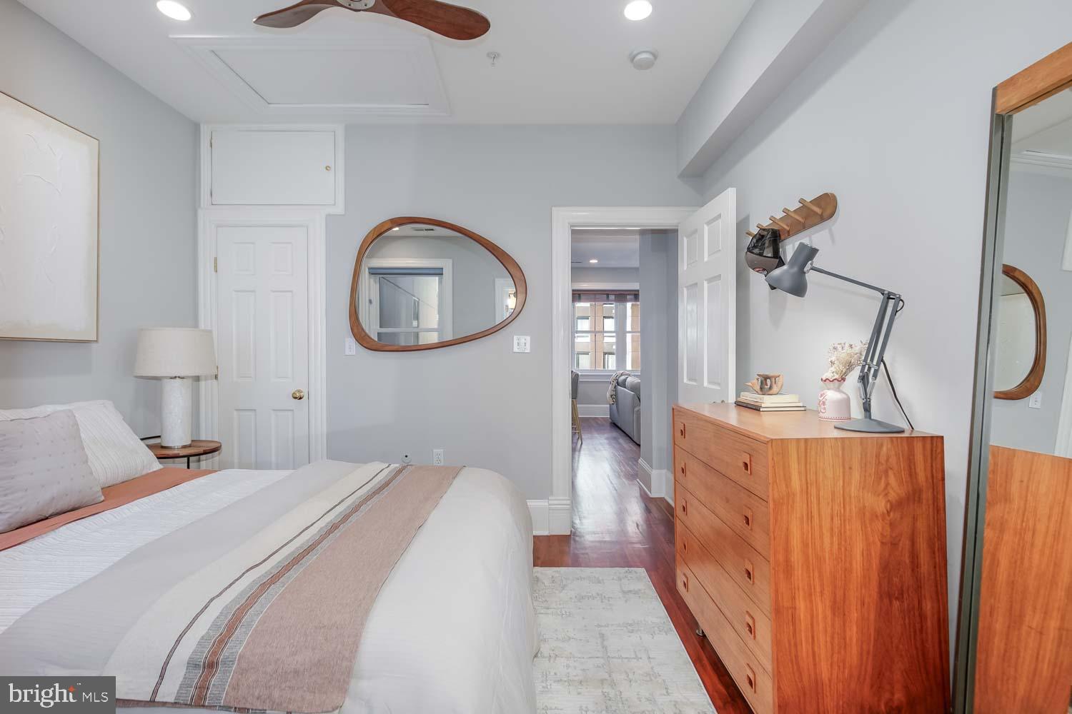 1212 M Street Northwest, Unit 401 Washington, DC 20005 - Photo 11 of 16 a bedroom with bed and wooden floor