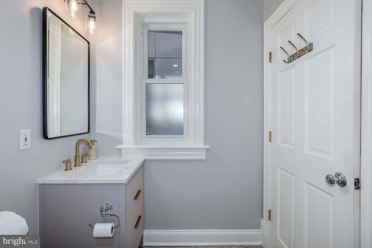 1212 M Street Northwest, Unit 401 Washington, DC 20005 - Photo 13 of 16 a bathroom with a sink and a mirror