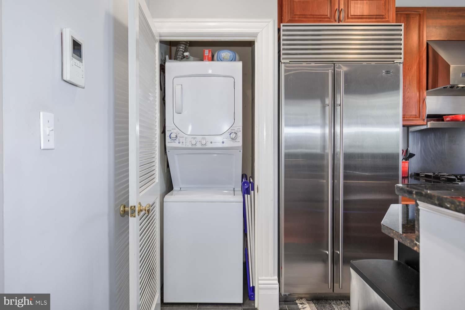 1212 M Street Northwest, Unit 401 Washington, DC 20005 - Photo 14 of 16 a close view of a utility room with washer and dryer