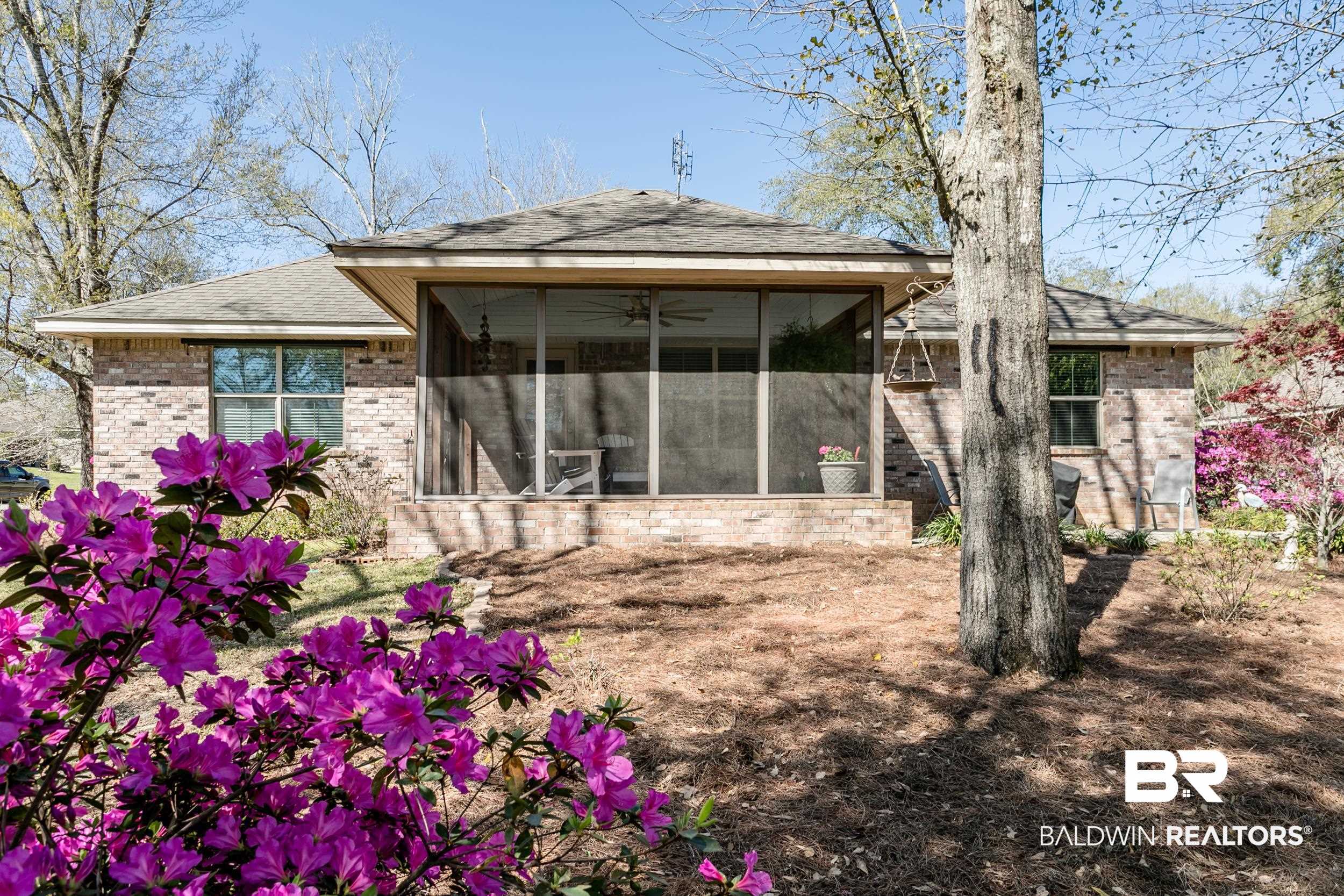 13154 Vincent Court Foley, AL 36535 - Photo 37 of 41 Back of house with brick siding, a sunroom, and a shingled roof