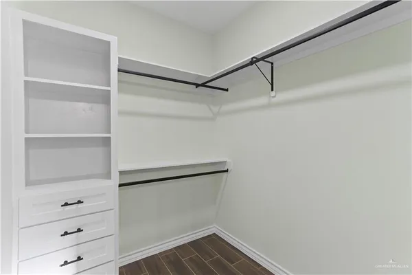 a view of an empty walk in closet