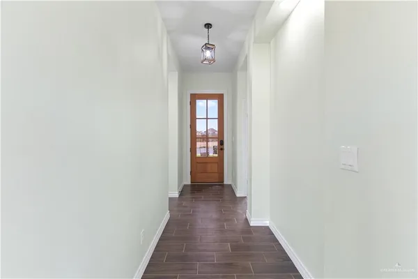 a view of a hallway with a white walls