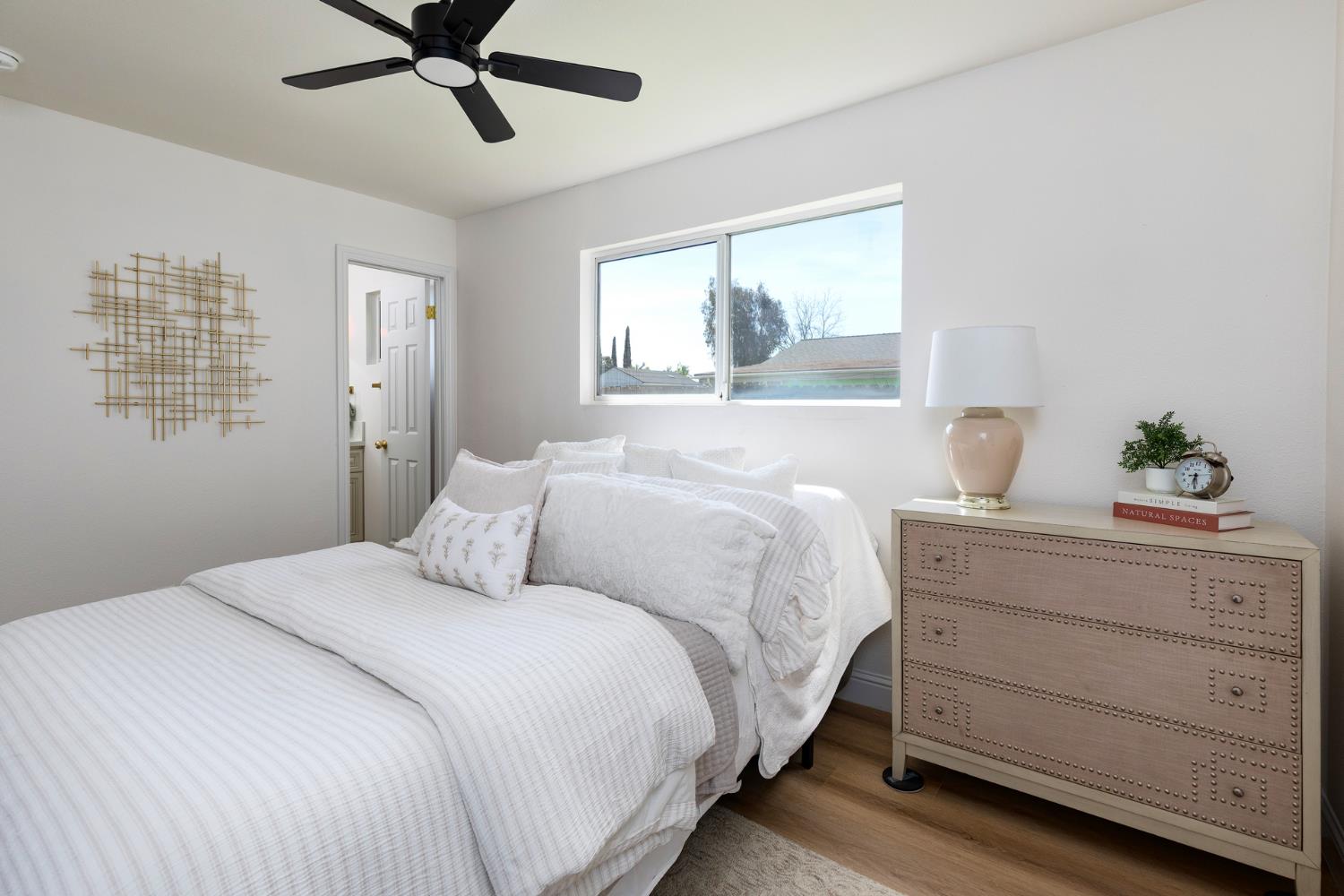 1185 East Evening Glow Circle Reedley, CA 93654 - Photo 30 of 42 a bedroom with a bed and cabinet