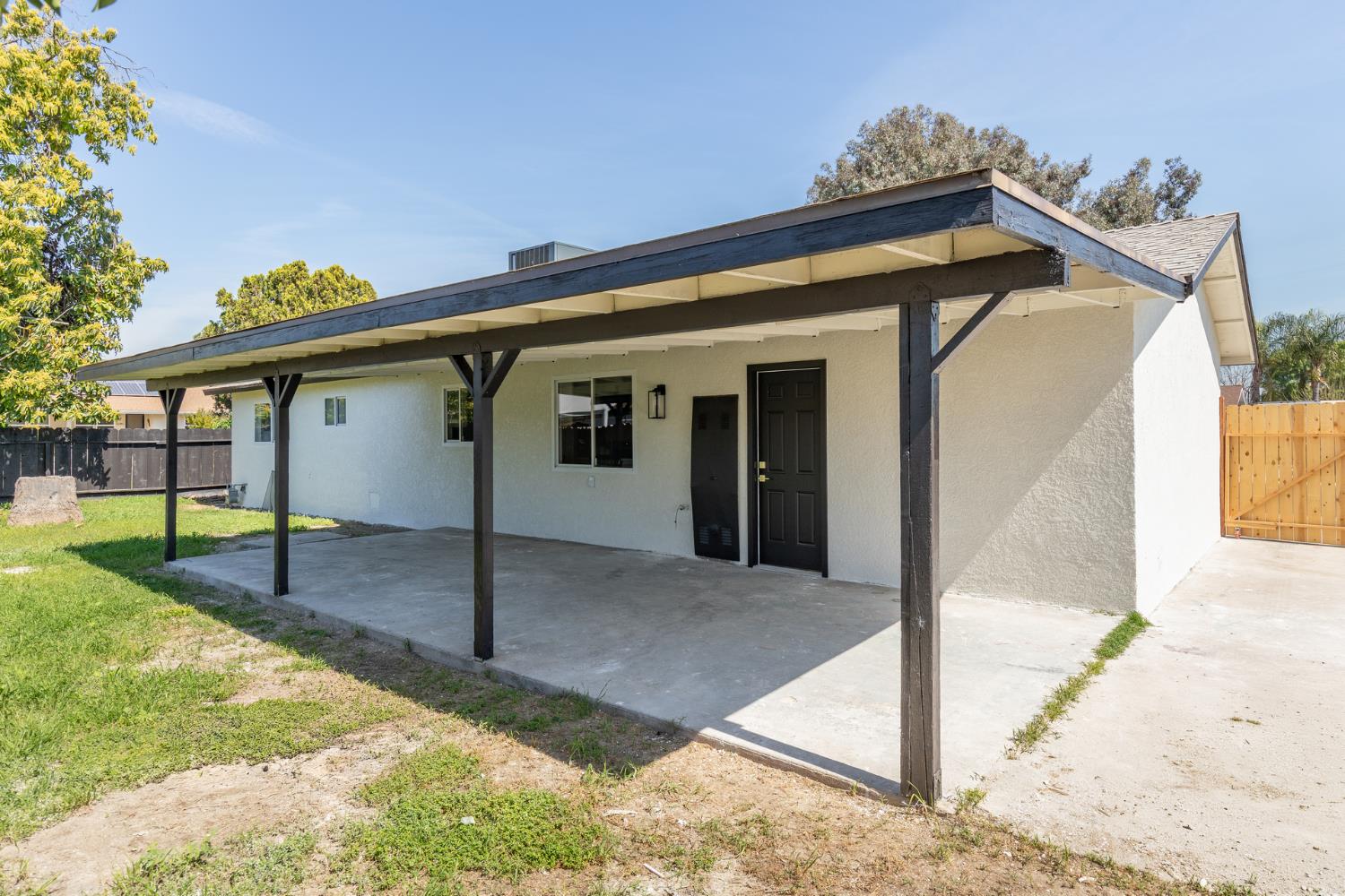 1185 East Evening Glow Circle Reedley, CA 93654 - Photo 40 of 42 a view of a house with a porch
