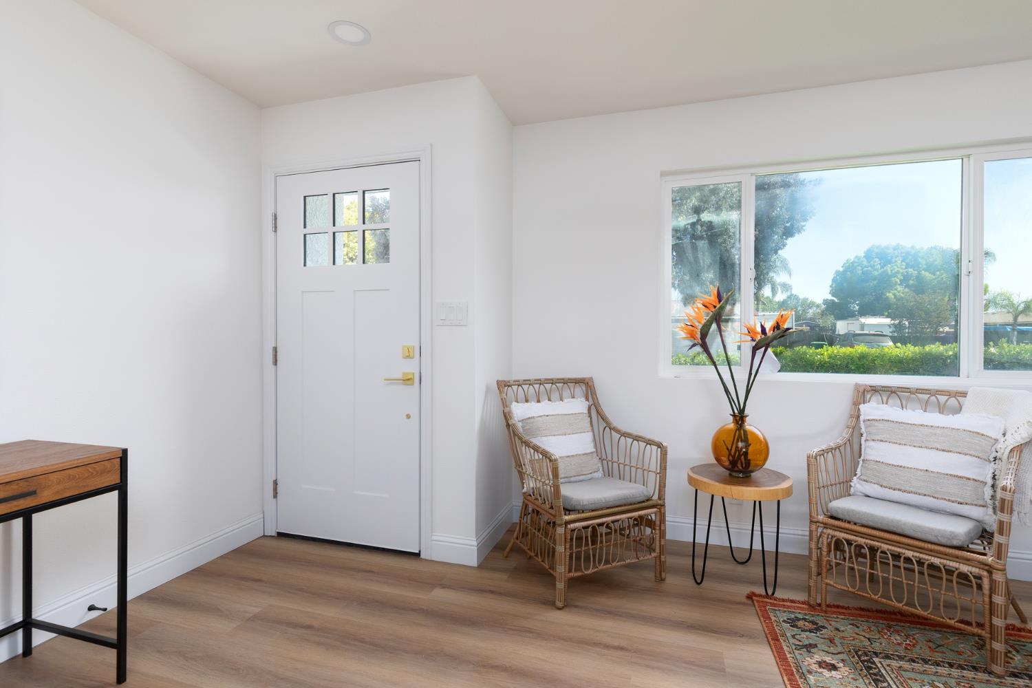 1185 East Evening Glow Circle Reedley, CA 93654 - Photo 6 of 42 a view of a livingroom with furniture and wooden floor
