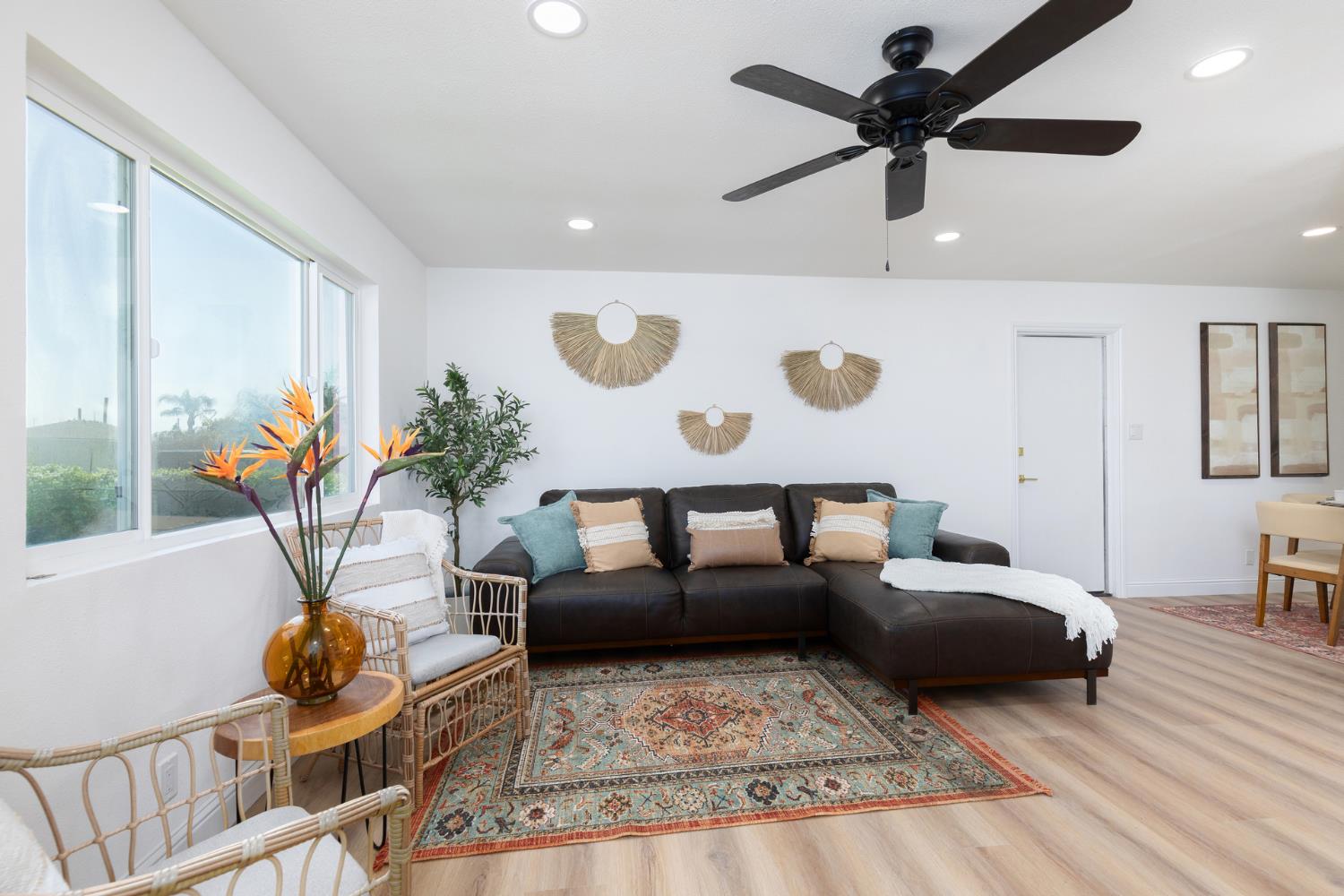 1185 East Evening Glow Circle Reedley, CA 93654 - Photo 7 of 42 a living room with furniture and wooden floor