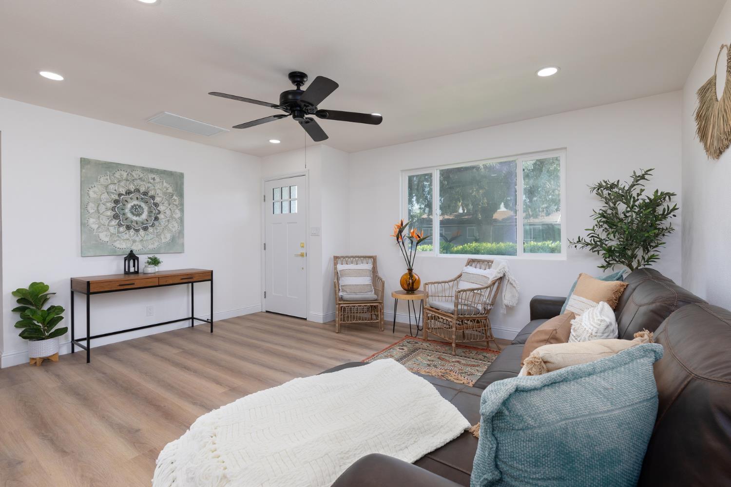 1185 East Evening Glow Circle Reedley, CA 93654 - Photo 9 of 42 a living room with furniture and a large window