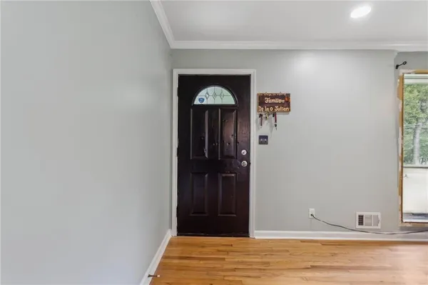 a view of entryway with wooden floor