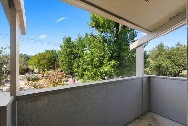 a view of a balcony with plants