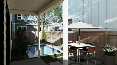 a backyard of a house with table and chairs