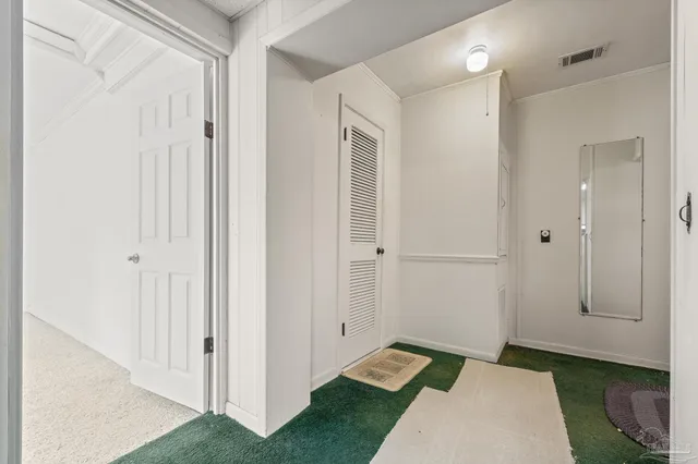 a kitchen with cabinets and stainless steel appliances