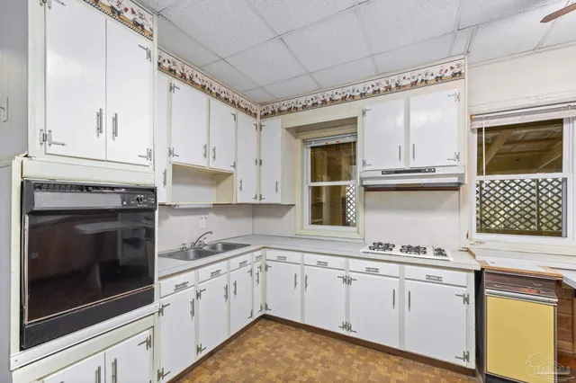 a view of a hallway with a chandelier