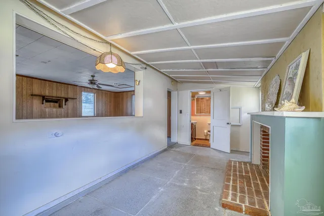 a backyard of a house with yard and outdoor seating