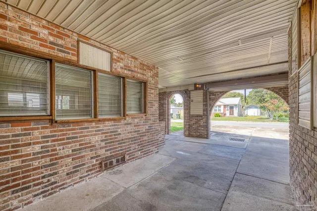 a view of backyard of house with green space