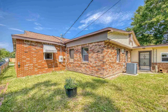 an aerial view of a houses with a lake view