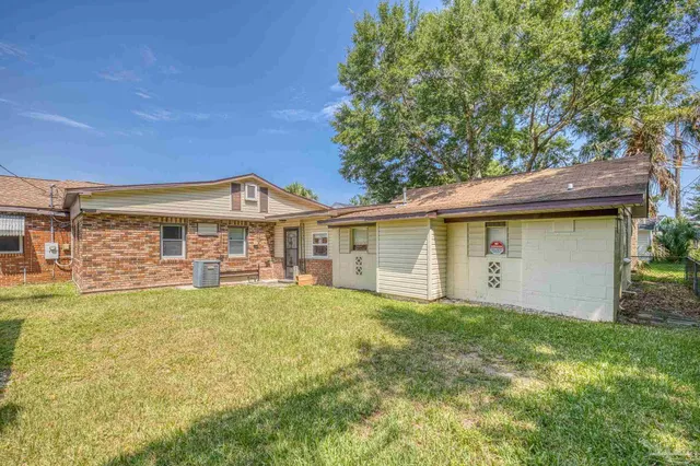 an aerial view of a houses with a lake view