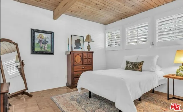 a bathroom with a sink a mirror and a toilet