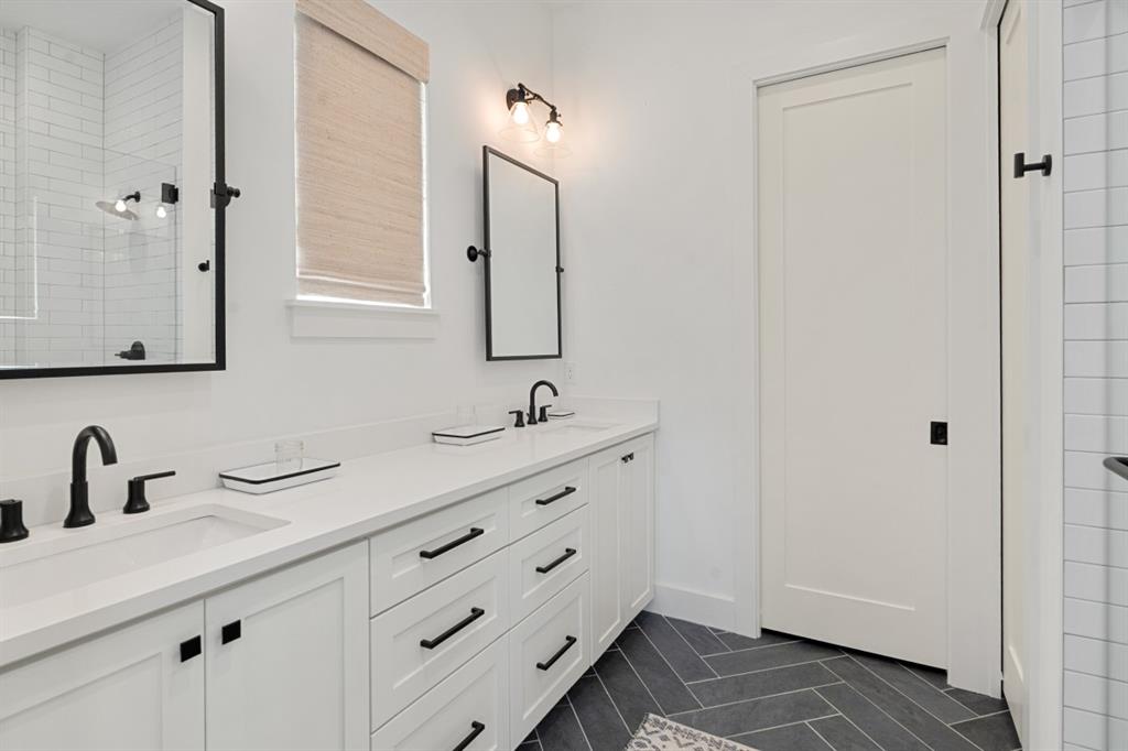2545 Homestead Court Tool, TX 75143 - Photo 18 of 39 a bathroom with a double vanity sink and mirror
