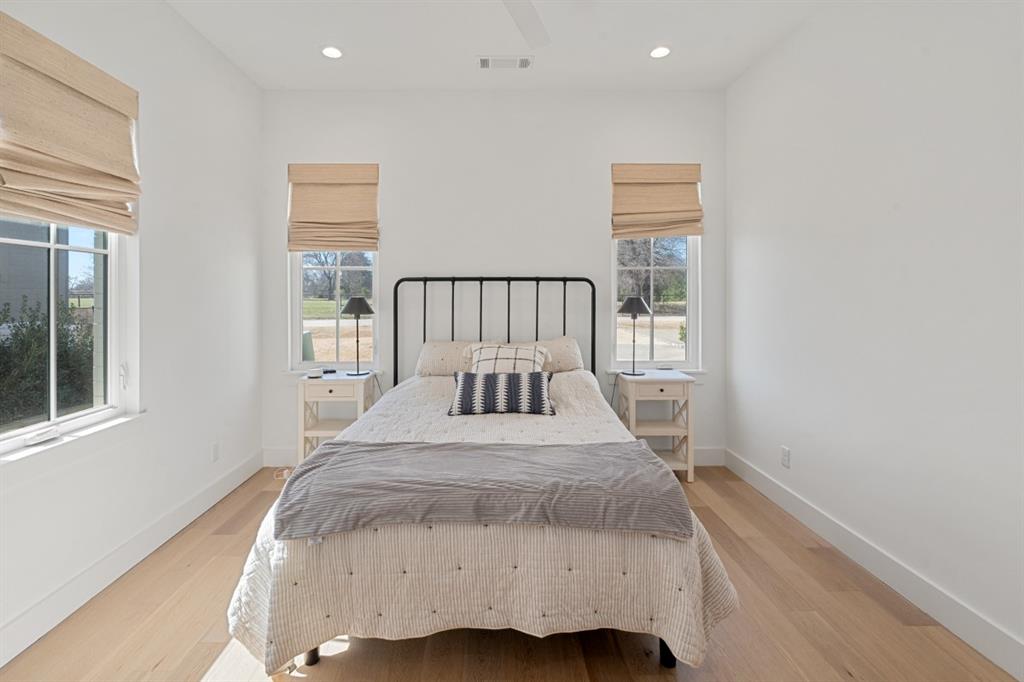 2545 Homestead Court Tool, TX 75143 - Photo 21 of 39 a bedroom with a bed and wooden floor