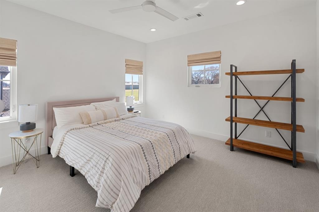 2545 Homestead Court Tool, TX 75143 - Photo 26 of 39 a bedroom with a bed a lamp and a window