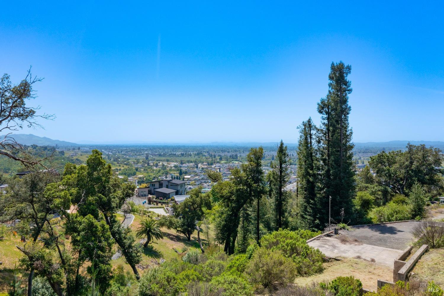 1058 Wikiup Drive Santa Rosa, CA 95403 - Photo 17 of 25 a view of a city with lush green forest
