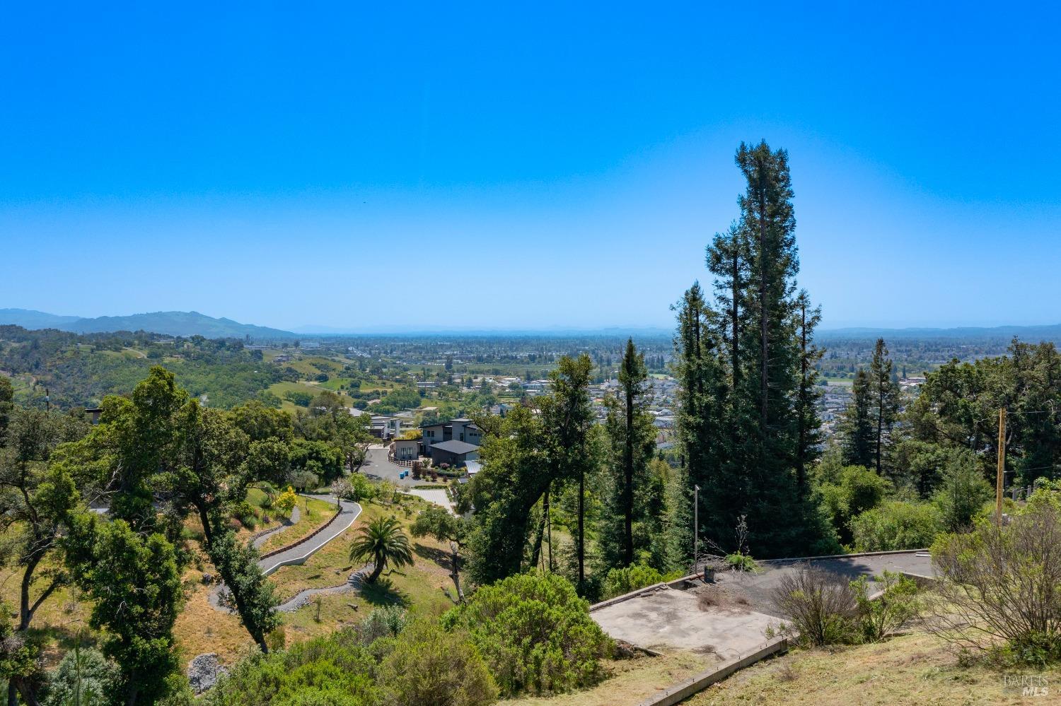 1058 Wikiup Drive Santa Rosa, CA 95403 - Photo 19 of 25 a view of a city with lush green forest