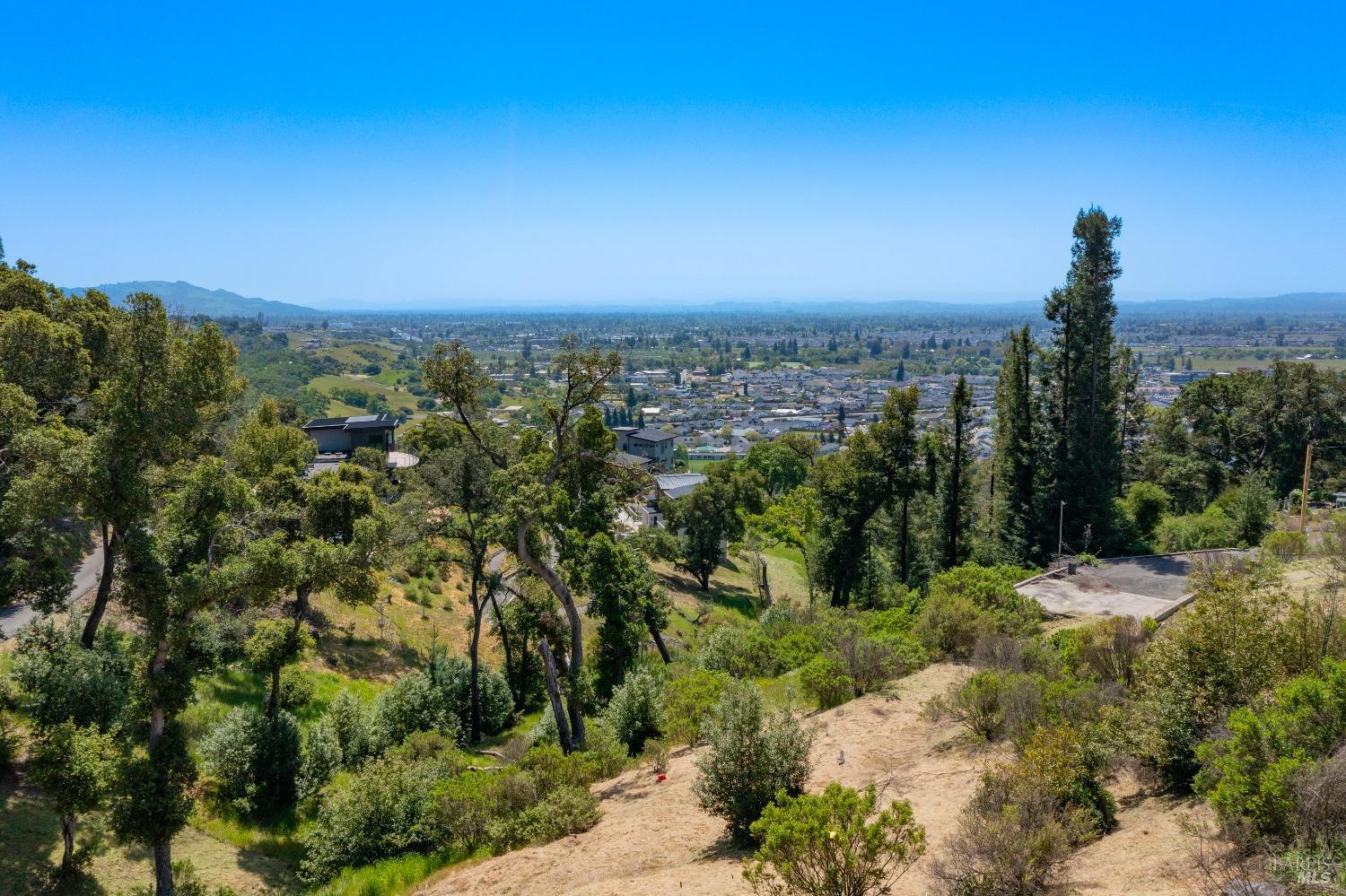 1058 Wikiup Drive Santa Rosa, CA 95403 - Photo 20 of 25 a view of a city with lush green forest