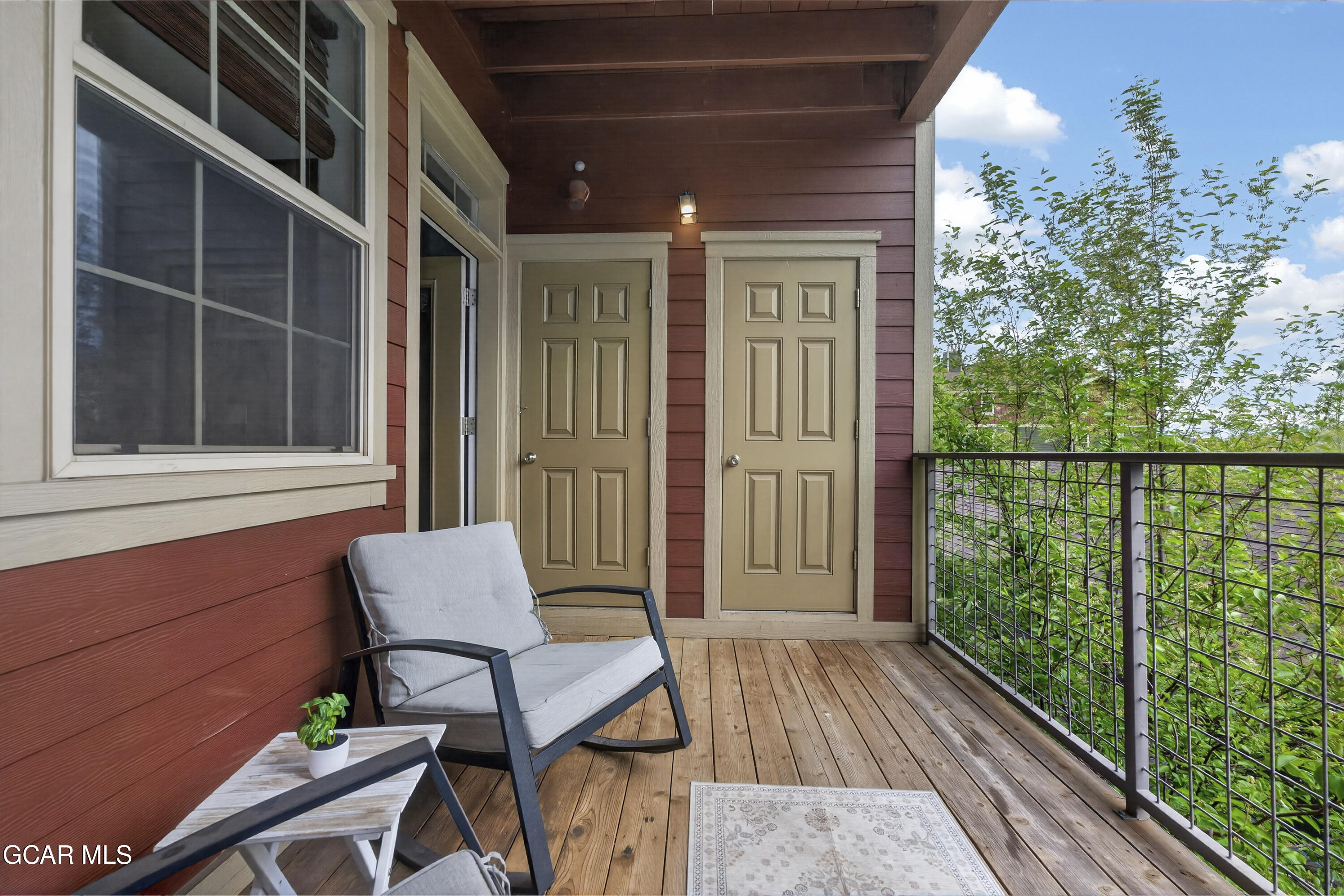 158 Village Road Granby, CO 80446 - Photo 29 of 46 a view of a porch with furniture and wooden floor