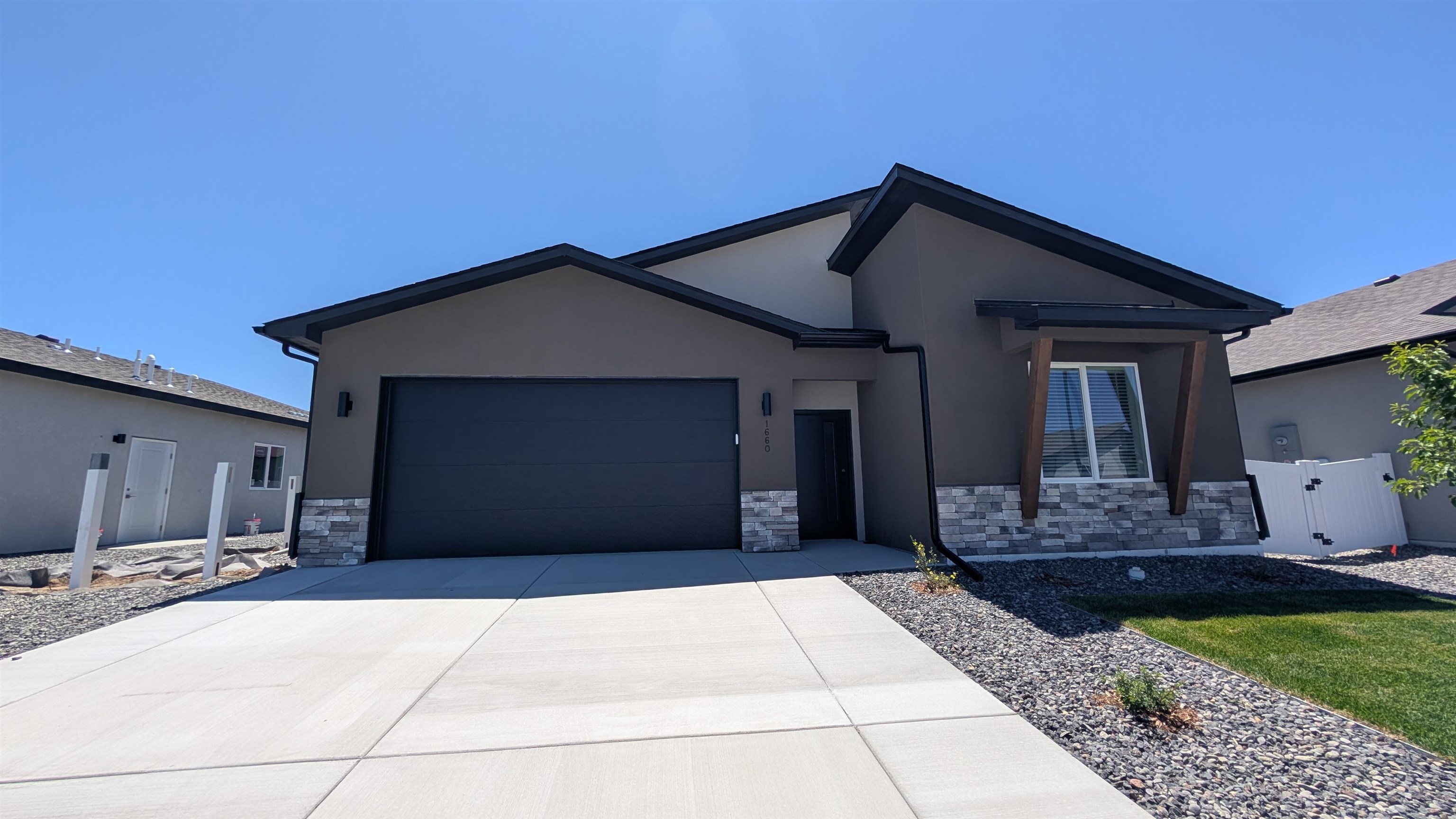 1660 Rusty Rivet Road Fruita, CO 81521 - Photo 1 of 15 a front view of a house with a yard