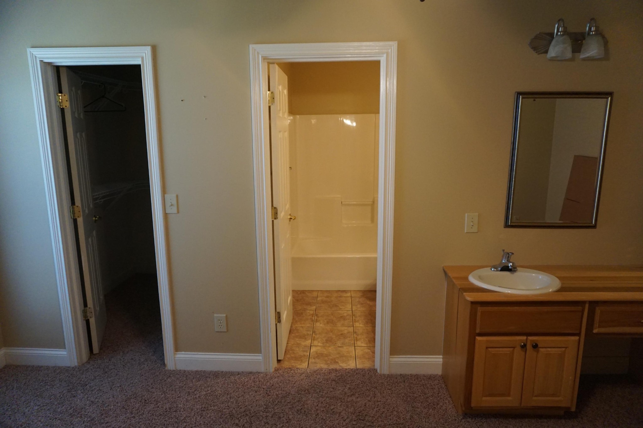 3845 Thomas Cross Road Sevierville, TN 37876 - Photo 5 of 12 a bathroom with a sink a mirror and a vanity