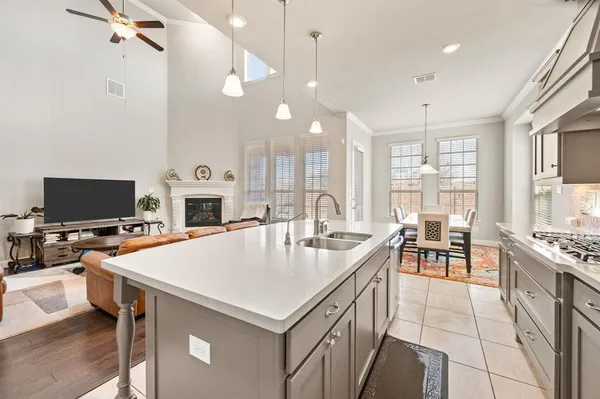 a large kitchen with a table and chairs