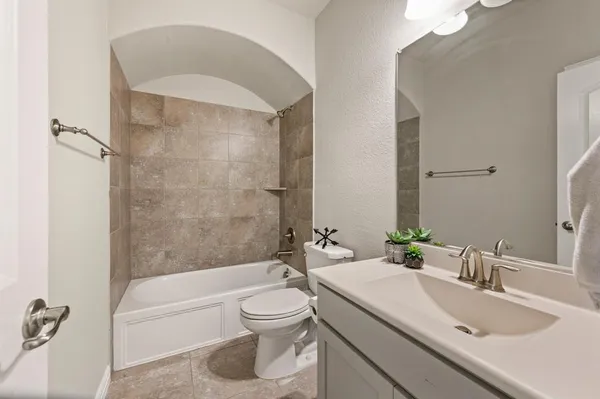 a bathroom with a sink a toilet and a bathtub