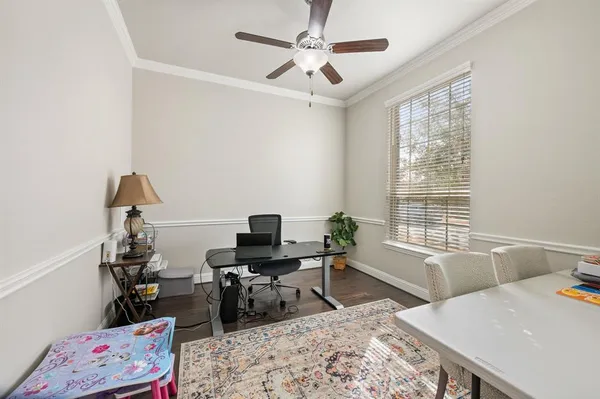 a reading room with furniture and a window